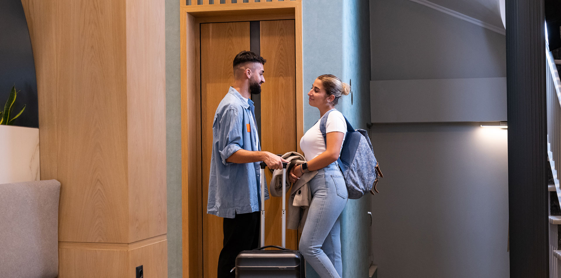 Enattica Suites, couple waiting for the elevator