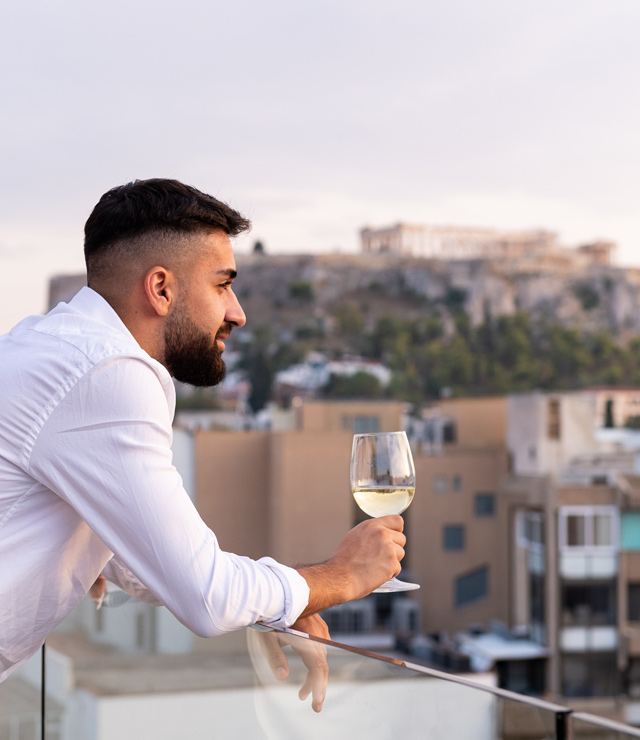 Drinking wine with Acropolis view